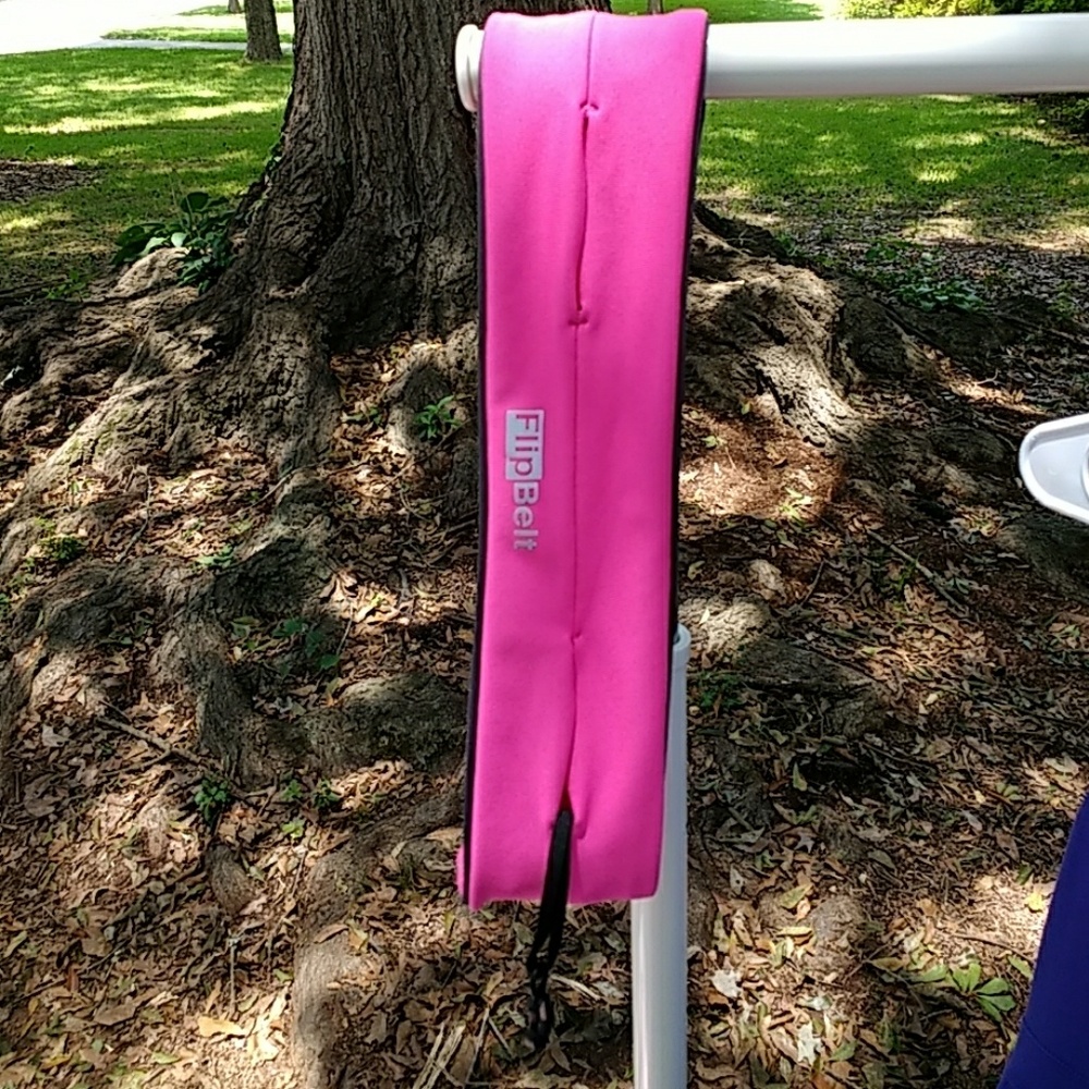 Flip Belt running belt. Hot pink. Medium.